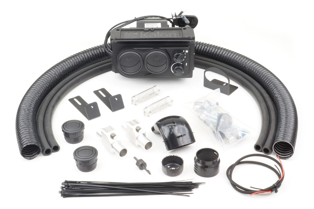 The John Deere 620 (2007-2011) - Ice Crusher Cab Heater kit is shown with a black heater unit, flexible hoses, mounting brackets, vents, connectors, wiring, zip ties, and hardware arranged neatly on a white background.