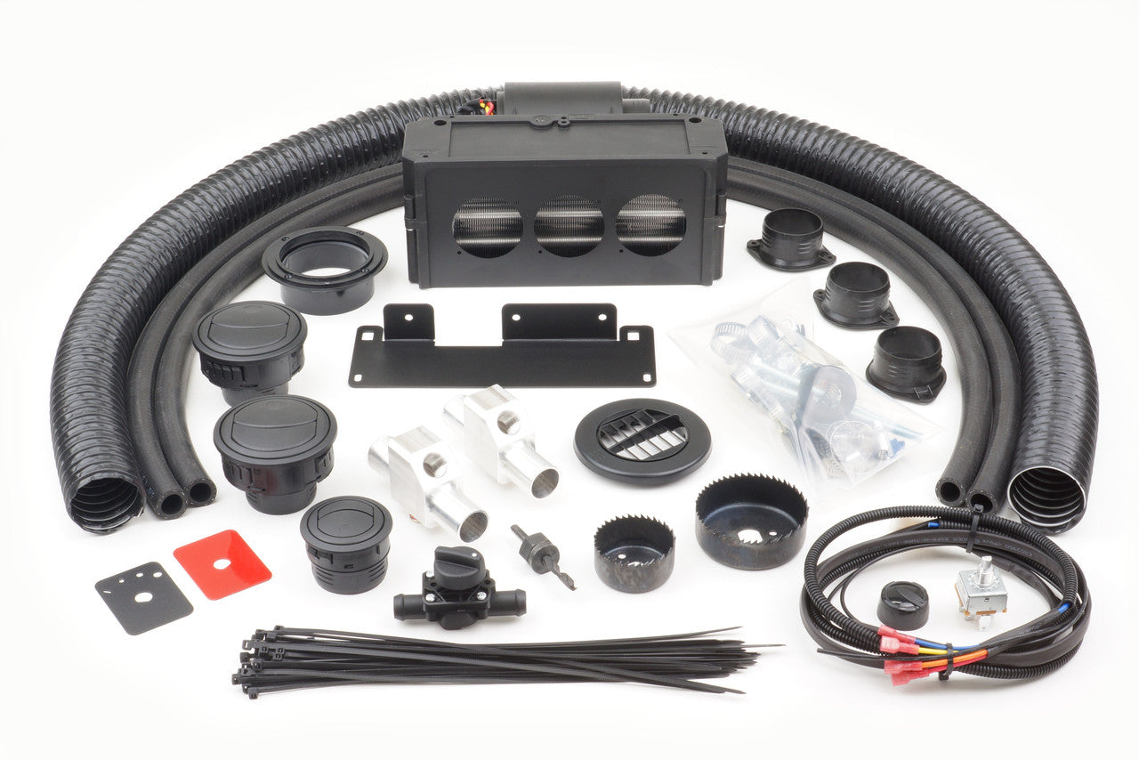The Honda Pioneer 500/520 (2015-2022) Ice Crusher Cab Heater kit includes black flexible ducts, vents and connectors, metal brackets, a rectangular housing unit, zip ties, wiring harness, cable connectors, mounts, and small hardware components.