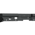 The image shows a 2019+ Ram 2500 Vaquero Rear Non-Winch Bumper (6 Sensor, Texture Black) mounting bracket featuring multiple holes and cutouts for attachment, with angular and flat surfaces, a raised center, and two side extensions. Transparent background