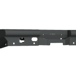 The image shows a 2019+ Ram 2500 Vaquero Rear Non-Winch Bumper (6 Sensor, Texture Black) mounting bracket featuring multiple holes and cutouts for attachment, with angular and flat surfaces, a raised center, and two side extensions. Transparent background