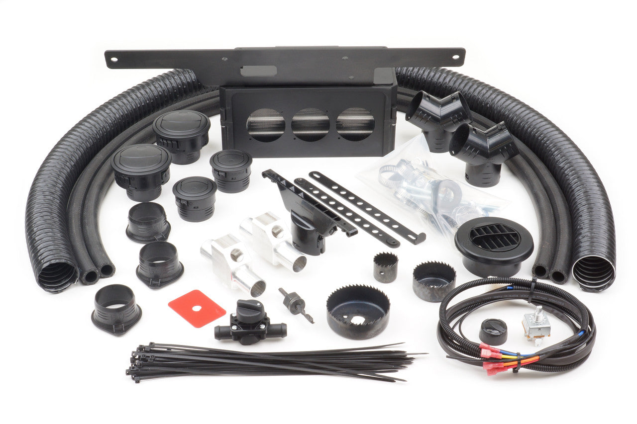 A complete set of black plastic components for the Honda Pioneer 700 (2014-2022) Ice Crusher Cab Heater, including hoses, vents, connectors, and mounting hardware, organized on a white background and ready for assembly.