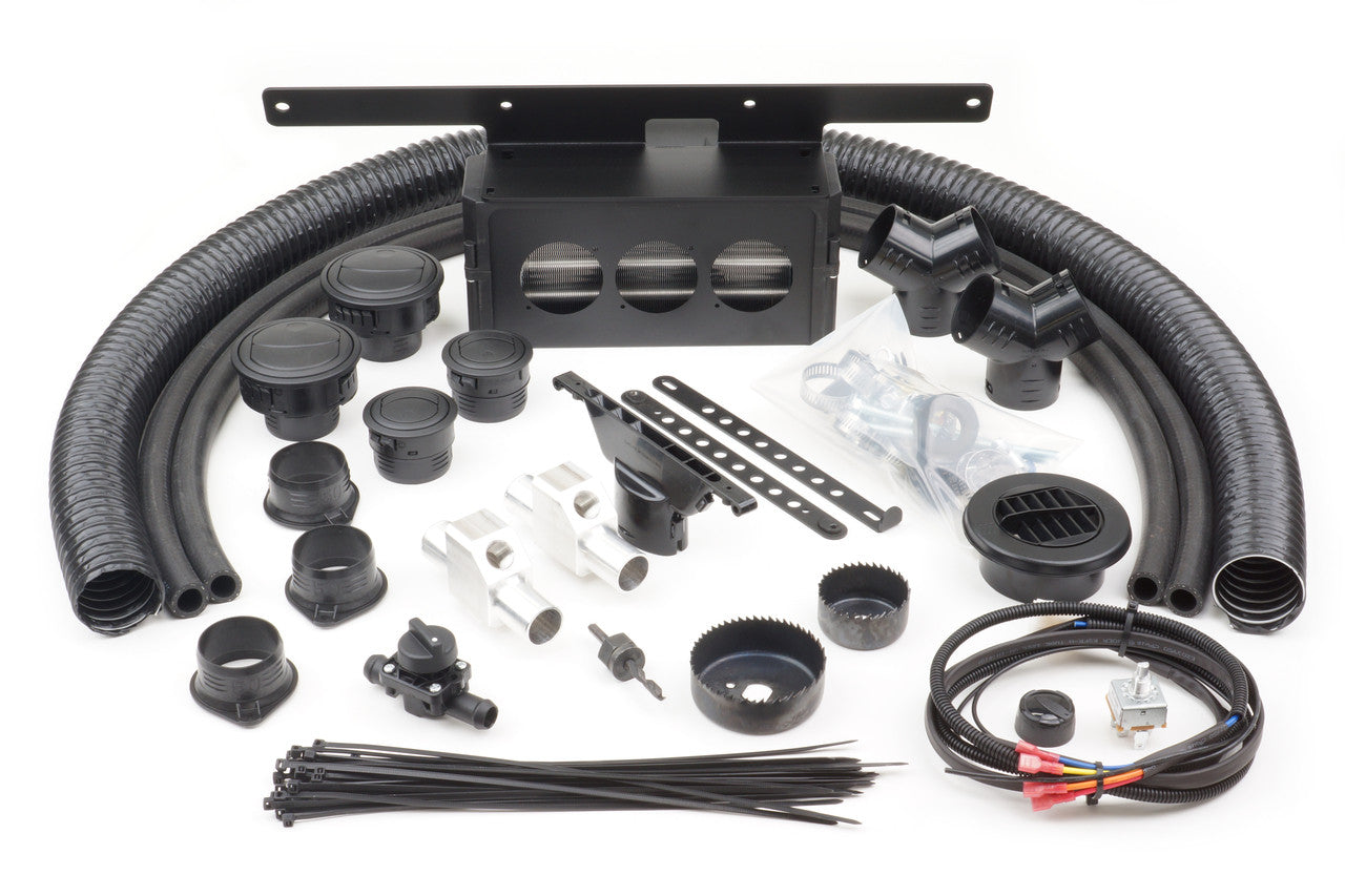 A Honda Pioneer 700 Deluxe (2017-2022) Ice Crusher Cab Heater kit with black ducts, vents, connectors, tubing, zip ties, brackets, wiring, and clamps arranged neatly on a white background for air distribution installation.