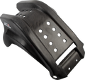 A black, carbon fiber motorcycle skid plate with a glossy finish. The plate features multiple circular cut-out holes for ventilation, reinforced edges, and sculpted contours for strength and fitment. A logo sticker is visible on the left side.