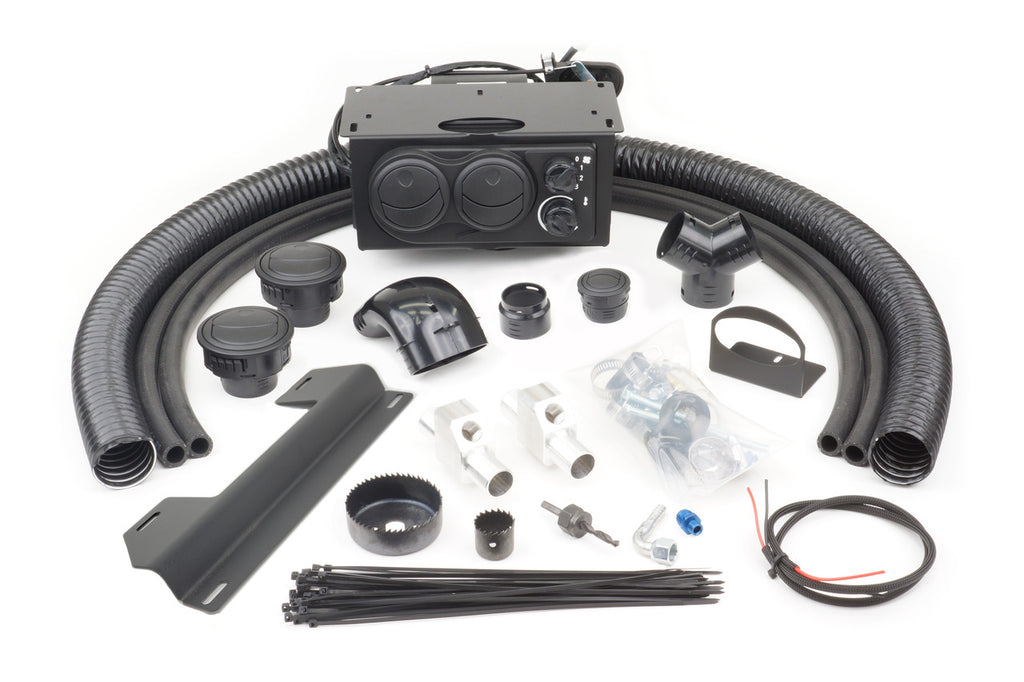 The Kawasaki Mule 4000/4010 and Trans Below Dash (2009+) Ice Crusher Cab Heater kit is shown on a white background, featuring black hoses, a rectangular heater unit with dials, connectors, mounting brackets, wires, clamps, zip ties, and installation hardw