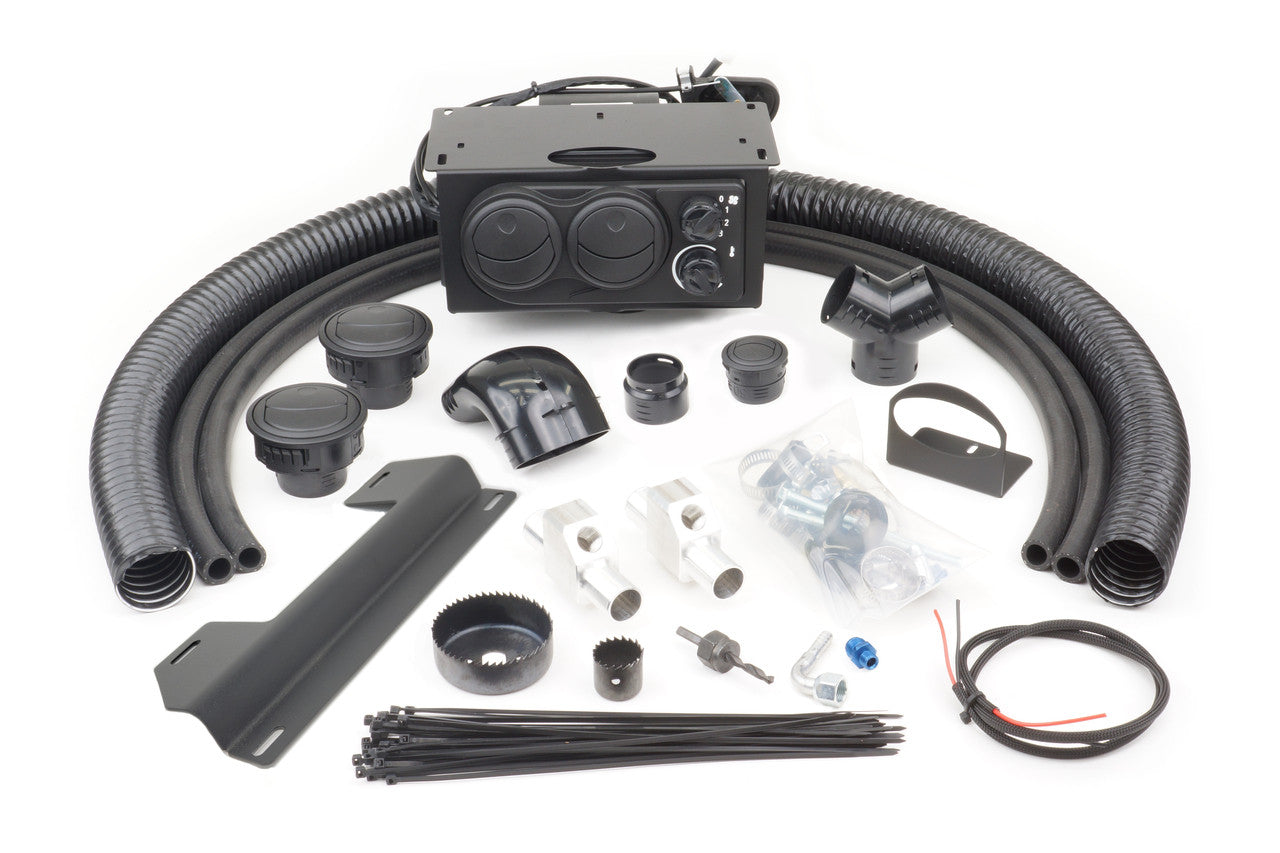 The Kawasaki Mule 4000/4010 and Trans Below Dash (2009+) Ice Crusher Cab Heater kit is shown on a white background, featuring black hoses, a rectangular heater unit with dials, connectors, mounting brackets, wires, clamps, zip ties, and installation hardw