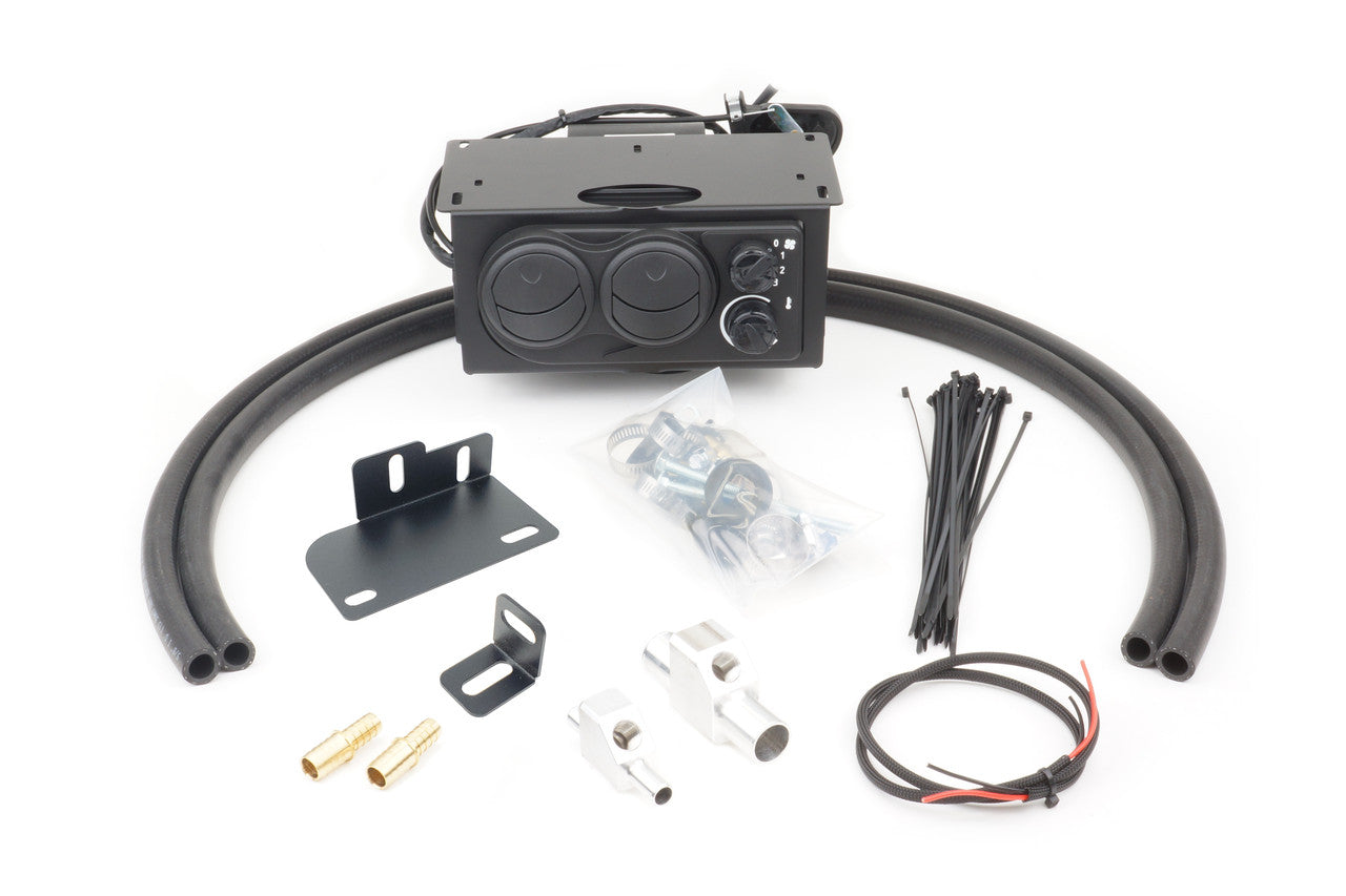 The Kubota RTV500 (2008-2019) Ice Crusher Cab Heater kit includes a black control unit, two large black hoses, zip ties, mounting brackets, brass fittings, metal clamps, screws, and a black-and-red wire arranged on a white background.