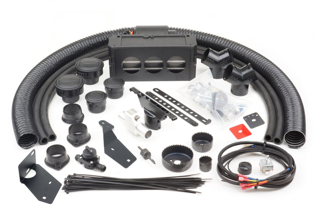 Ice Crusher Cab Heater components for Kubota RTV-X900 (2013-2021)—including hoses, connectors, brackets, cable ties, wiring, screws, a control box, and hole saws—are neatly arranged on a white surface.