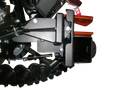 Close-up view of a mechanical component with a black metal bracket, bolts, spring, and part of a rubber track system. An orange part labeled Can-am is partially visible in the background, with a white background behind the machinery.