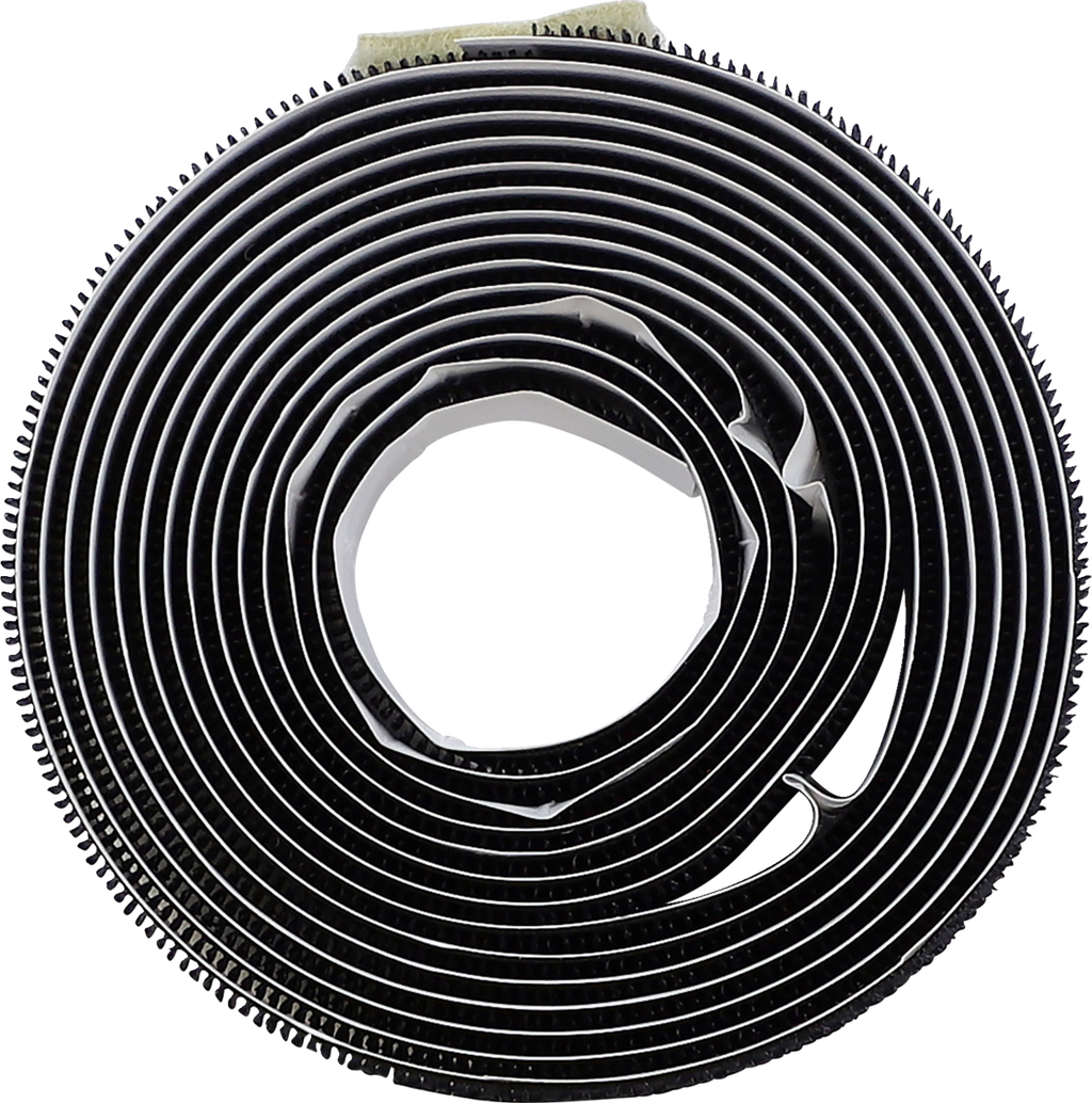 A close-up top view of a tightly wound black adhesive foam tape roll with a slightly glossy surface, showing concentric circular layers and a visible hole in the center. The tape edges display fine texture and serrations.