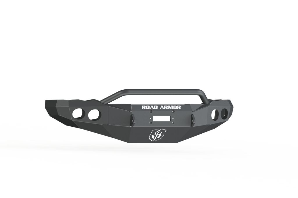 A 2003-2005 Ram 2500 Stealth Front Winch Bumper Pre-Runner Guard in textured black, featuring angular edges, a central hoop bar, side cutout circles, and ROAD ARMOR in white above the logo on a white and black abstract background. Compatible with Warn M12