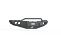 A 2003-2005 Ram 2500 Stealth Front Winch Bumper Pre-Runner Guard in textured black, featuring angular edges, a central hoop bar, side cutout circles, and ROAD ARMOR in white above the logo on a white and black abstract background. Compatible with Warn M12