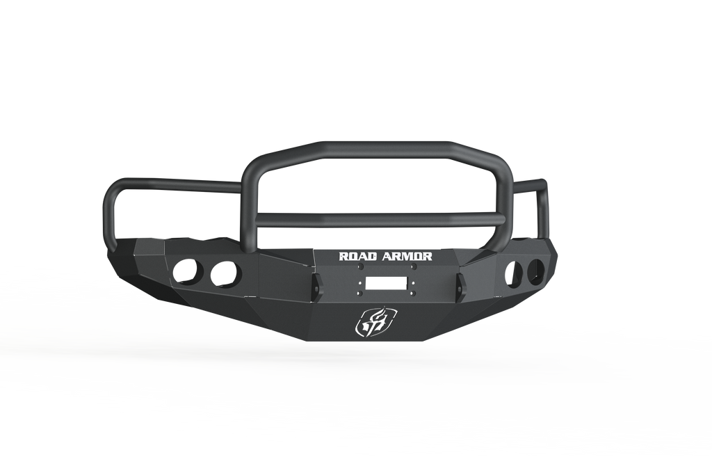A 2003-2005 Ram 2500 Stealth Front Winch Bumper Lonestar Guard in textured black, featuring ROAD ARMOR text with a shield logo, round cutouts, angular detailing, and compatible with Warn M12000 & Smittybilt XRC winches. Shown on white background.