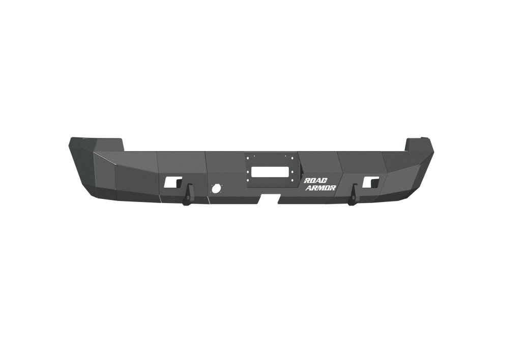 The 2003-2009 Ram 2500 Stealth Rear Winch Bumper in textured black has angular edges, accessory cutouts, and bold “ROAD ARMOR” text. The bumper fits Warn M8000 or 9.5Xp winches and is photographed on a white background.