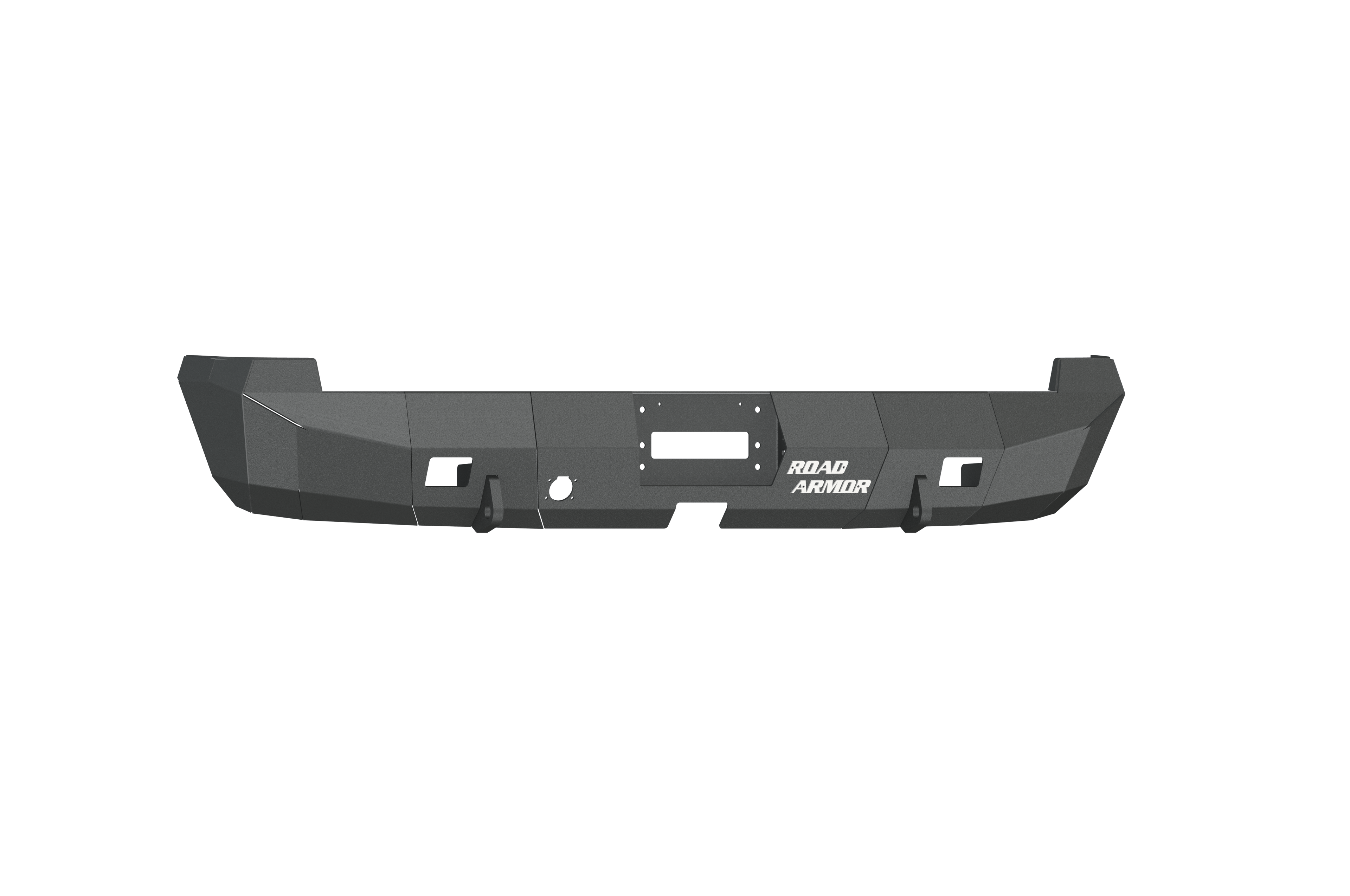 The 2003-2009 Ram 2500 Stealth Rear Winch Bumper in textured black has angular edges, accessory cutouts, and bold “ROAD ARMOR” text. The bumper fits Warn M8000 or 9.5Xp winches and is photographed on a white background.