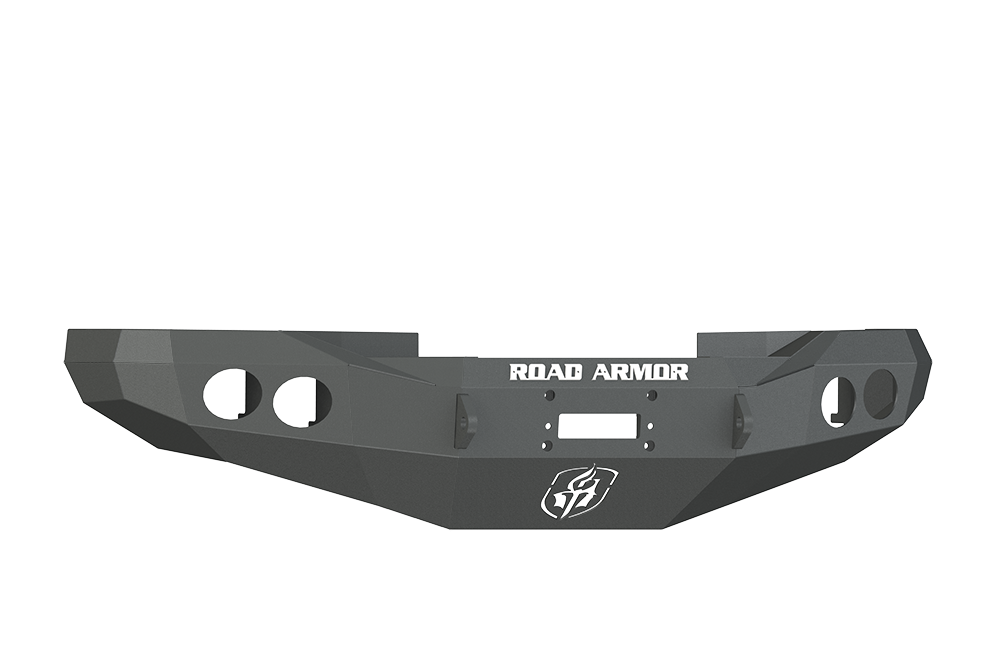 A textured black Stealth Front Winch Bumper for 1997-2002 Ram 2500 features angular edges, circular cutouts, a central rectangular winch mount slot (Warn M12000/Smittybilt Xrc), and a white ROAD ARMOR logo across the center.