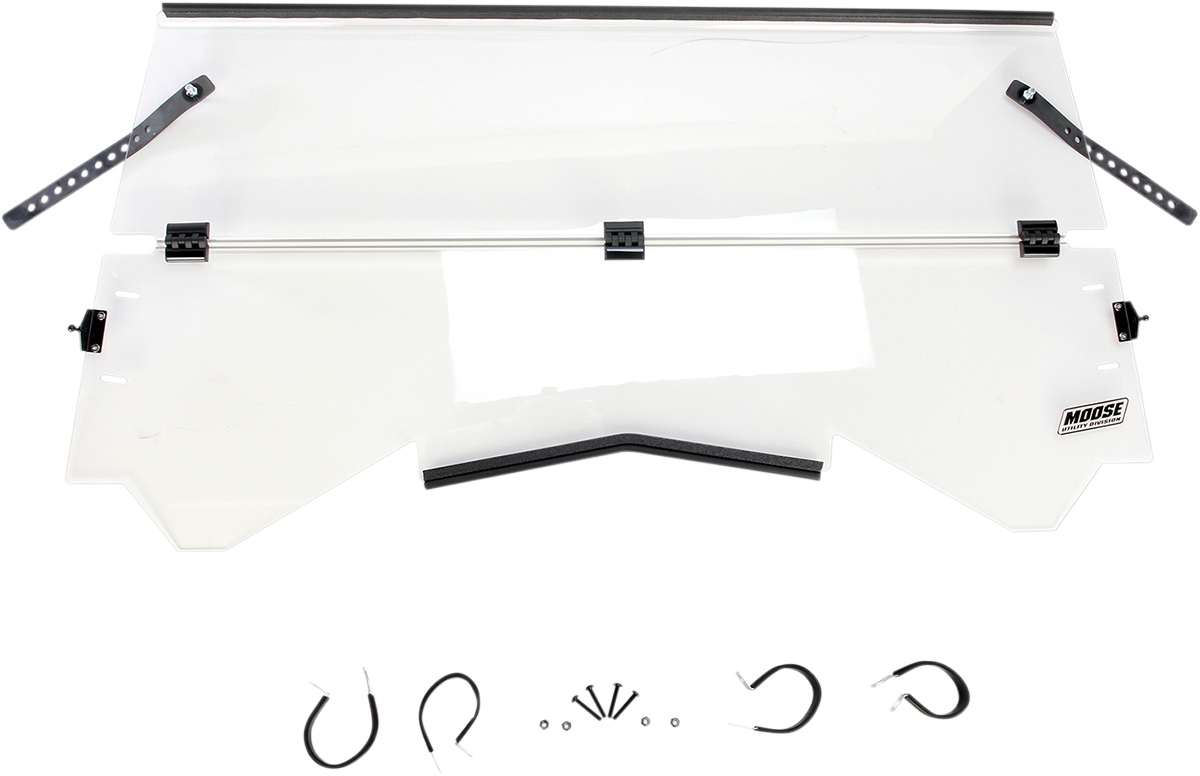 A clear, rectangular windshield with black mounting brackets and straps attached at the top corners. The lower edge is slightly angled with two black latches near each side. Below the windshield are various metal mounting hardware pieces arranged in a row