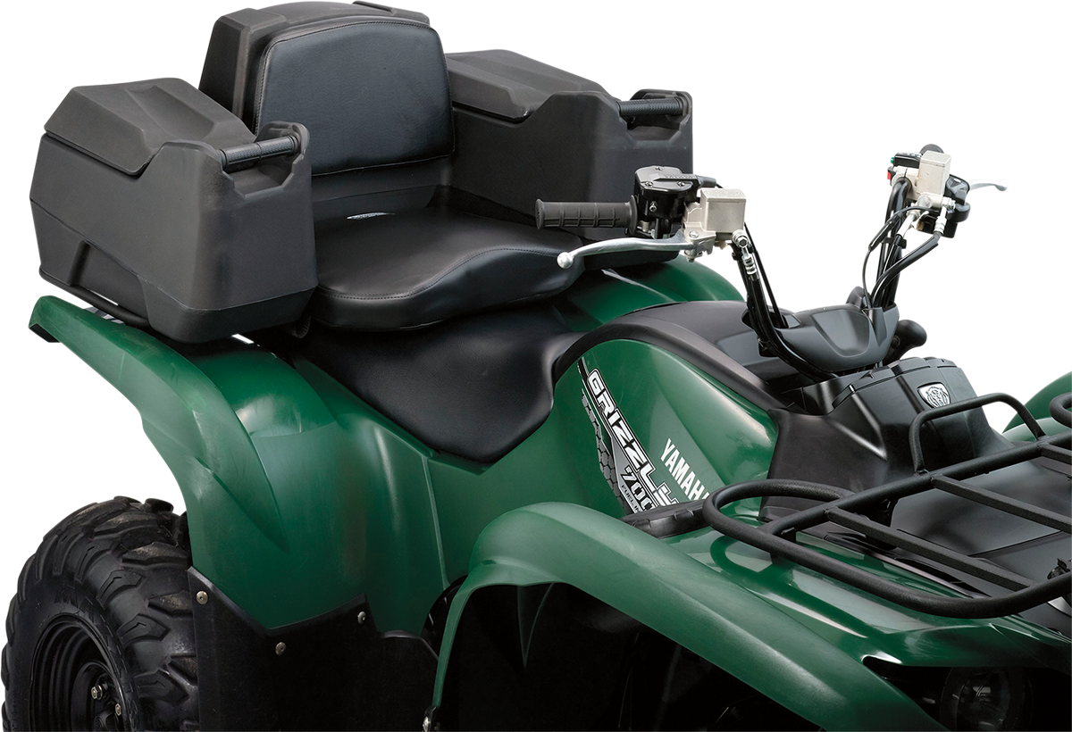 A close-up of a green Yamaha Grizzly all-terrain vehicle (ATV) showing the front handlebars, black seat with backrest, and two large, black, hard storage boxes mounted at the rear. The vehicle appears sturdy and is designed for rough terrain.