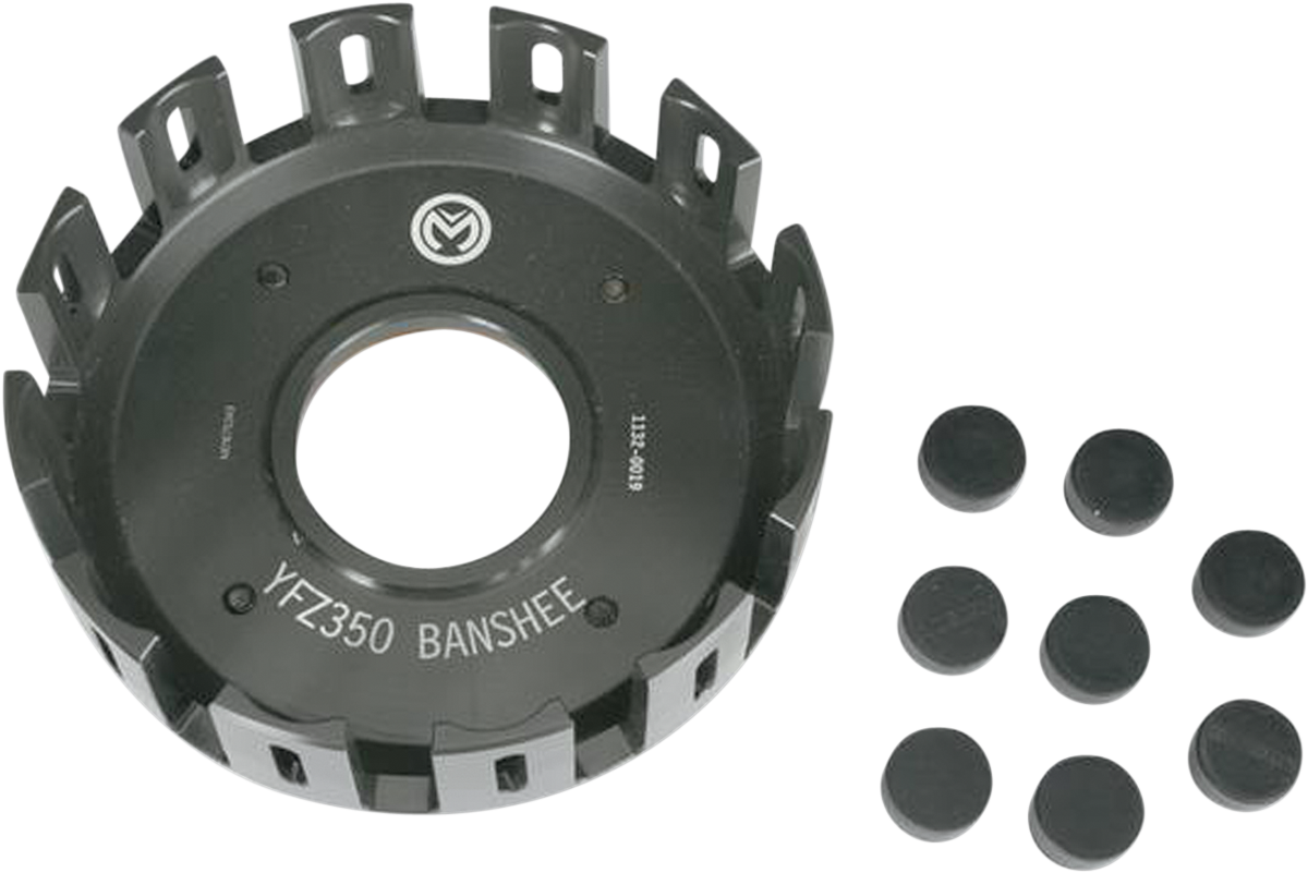 A black metal clutch basket labeled YFZ-350 BANSHEE with a circular center hole and rectangular slots around the edge, displayed alongside nine small black cylindrical rubber plugs arranged in rows.