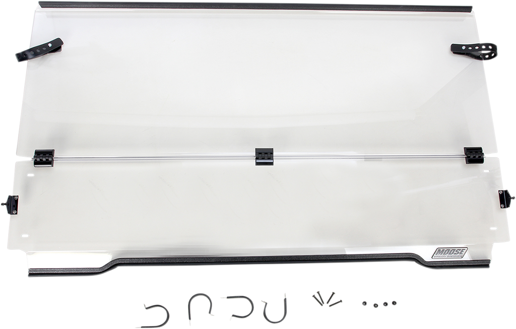 A clear, rectangular windshield with black mounting brackets and hardware attached. The bottom edge features a black border and a Moose logo. Below the windshield, several small, black mounting parts and fasteners are arranged on a white background.
