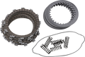 A set of motorcycle clutch components on a white background: a stack of friction plates (left), a stack of steel plates (top right), and several coiled clutch springs (bottom right), all organized in separate groups.