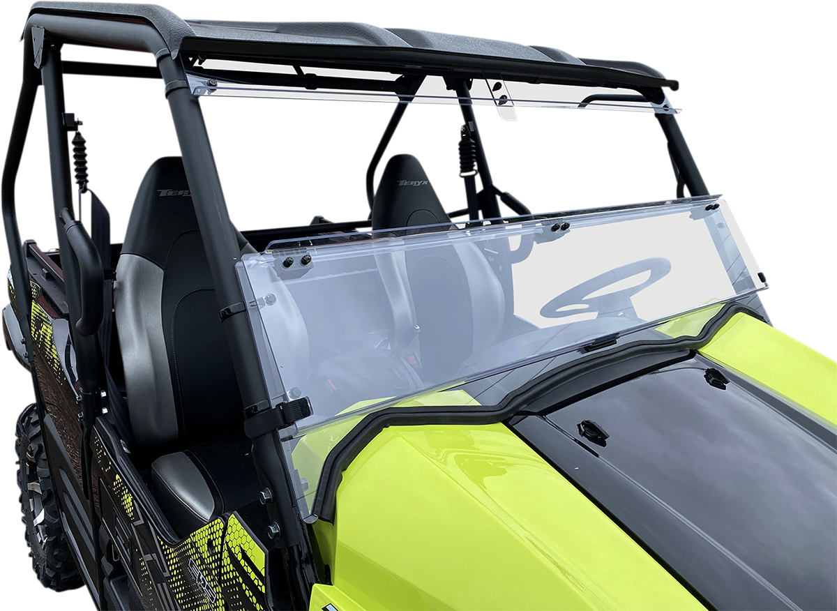 A bright yellow off-road utility vehicle with a clear, two-piece polycarbonate windshield and black roof. The windshield is partially open, revealing two black seats and a black dashboard, with a white background isolating the vehicle.