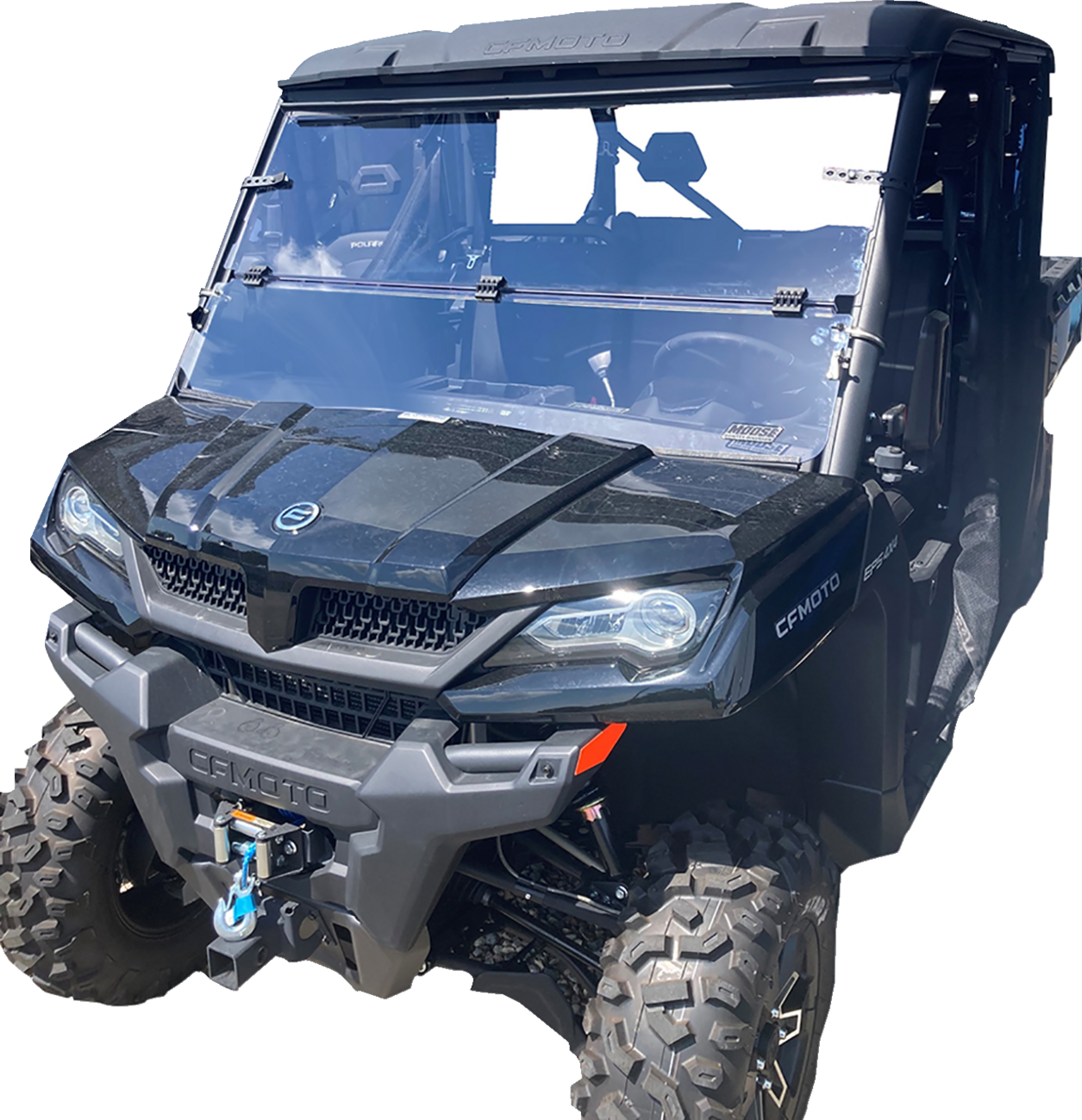 A black CF MOTO utility terrain vehicle (UTV) with large off-road tires, a roof, clear front windshield, and a winch mounted on the front bumper, pictured from the front left angle on a white background.