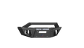 The 2018+ Jeep Wrangler Stealth Front Winch Bumper Sheetmetal Guard Competition Cut in texture black is shown. It features the “ROAD ARMOR” logo, a red, white, and blue emblem, plus visible winch and light mounting points.
