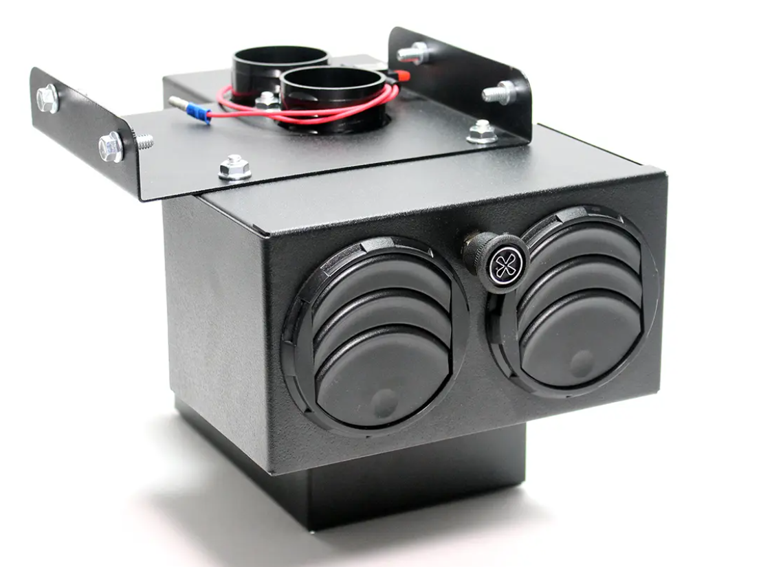 The Inferno Cab Heater Kit for Polaris RZR 570 (2012-Current) features a black metal unit with dual circular air vents, a front fan control knob, red and blue wires secured on top, all mounted on a rectangular base against a white background.