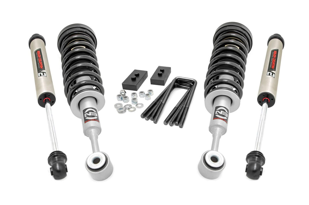 A 2.5 Inch Lift Kit for Ford F-150 (2004-2008) is displayed with N3 struts featuring a red, black, and white N3 Rough Country logo, black mounting blocks, washers, nuts, and four black U-bolts on a white background.