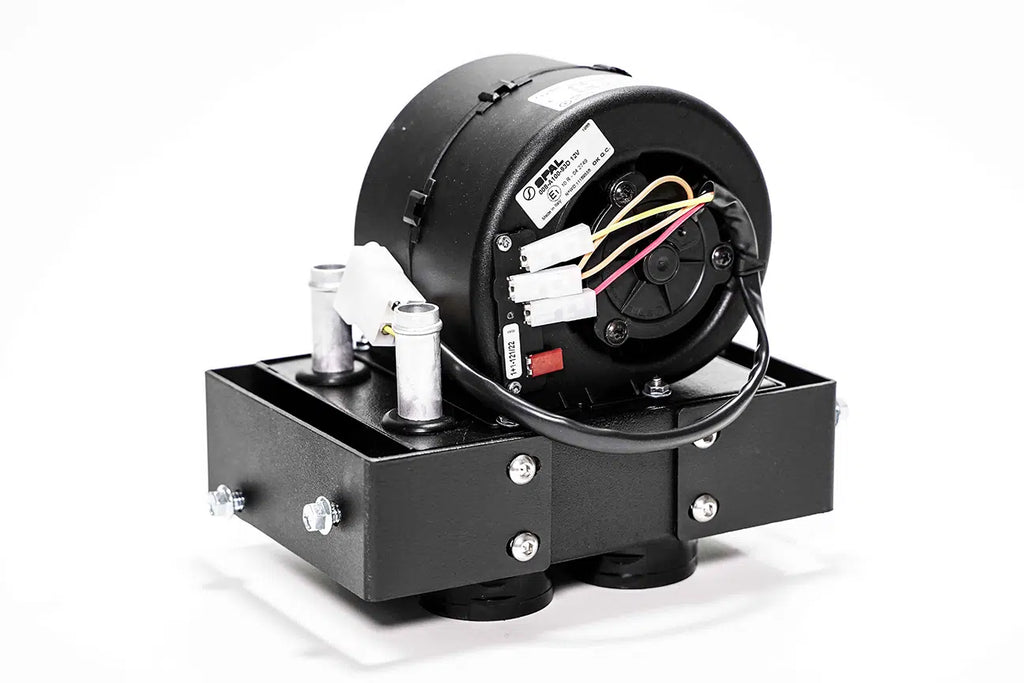 A Polaris Ranger SP 570 Mid Size Cab Heater with Defrost (2022-Current) featuring a cylindrical motor housing on a rectangular base, visible wiring, two silver canisters, and bolts. Set against a plain white background.
