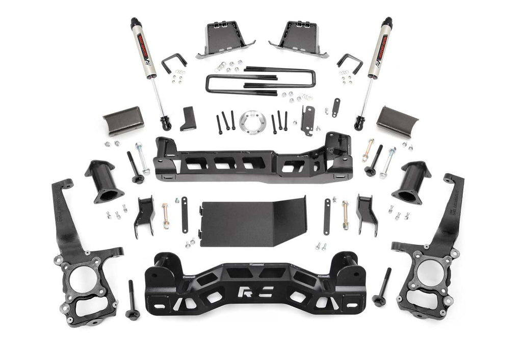 The 6 Inch Lift Kit | V2 for Ford F-150 4WD (2011-2014) is displayed on a white background, featuring black steel brackets, crossmembers, shocks, bolts, spacers, control arms, and mounting hardware arranged symmetrically.