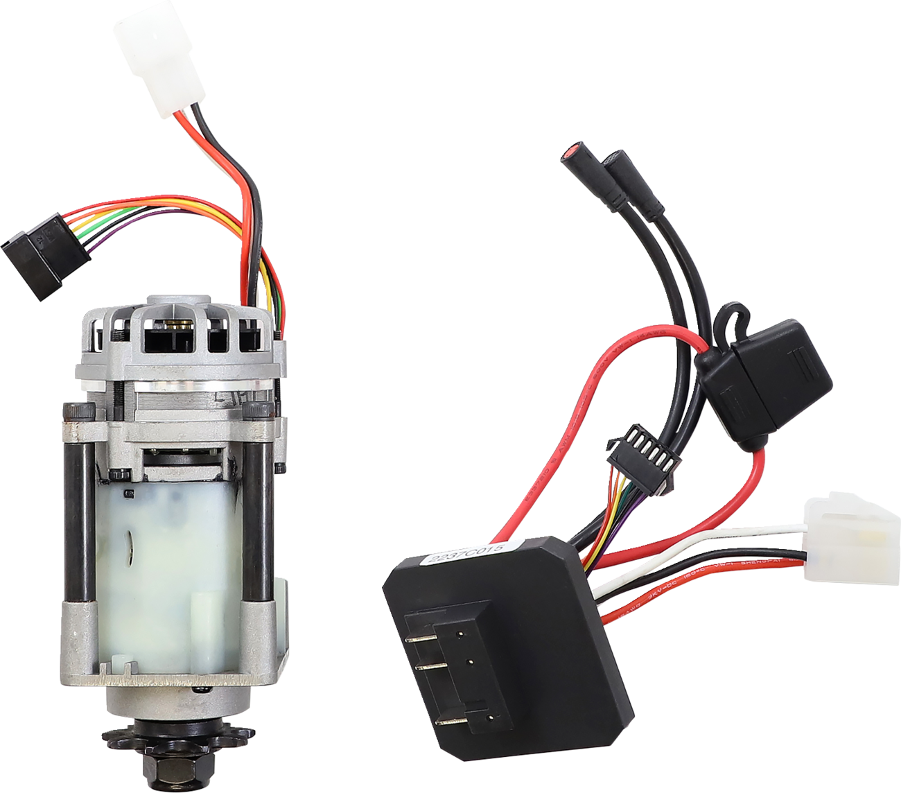 Two components are shown: on the left, a cylindrical electric motor with visible wiring and connectors; on the right, a cluster of wires with connectors and a rectangular black module attached. Both are set against a plain white background.