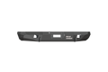 A 1999-2007 Ford F-250 Stealth Rear Winch Bumper in textured black steel, featuring a central winch slot for Warn M8000 or 9.5Xp, two rectangular light cutouts, and the white Road Armor logo on the right side against a plain white background.