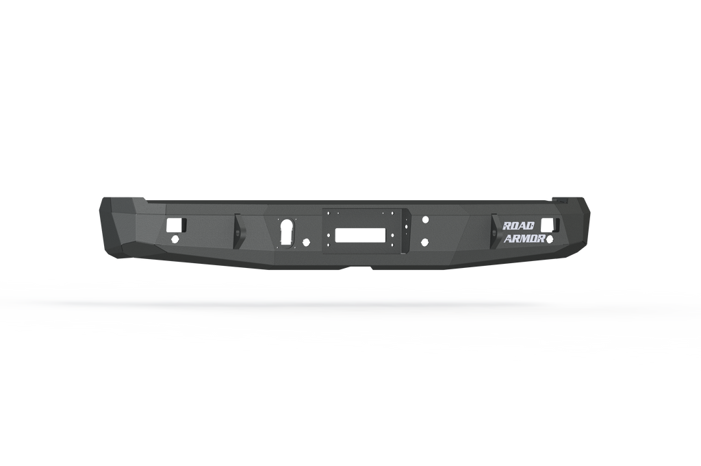 The 2015-2020 Ford F-150 Stealth Rear Winch Bumper in textured black features angular edges, accessory cutouts, and a white Road Armor logo on the right, shown on a plain white background with shadow. Compatible with Warn M8000 or 9.5Xp winches.