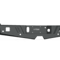 The 2017+ Ford F-250 Spartan Rear Bumper by Road Armor features a textured black finish, angular metal design with multiple cutouts, mounting points, and a rugged style ideal for off-road vehicles.