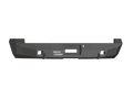 The 2008-2016 Ford F-250 Stealth Rear Winch Bumper in texture black features angular edges, a matte finish, central winch cutout for Warn M8000 or 9.5Xp, accessory mounts, and displays the Road Armor logo in white on the left side.