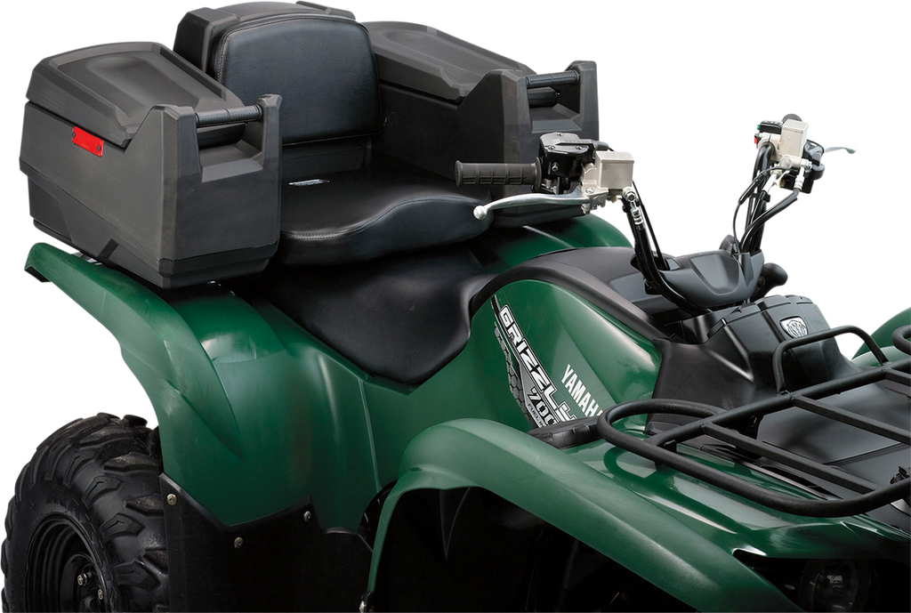 A green Yamaha Grizzly all-terrain vehicle (ATV) with a black seat, dual handlebars, rear cargo box, padded passenger backrest, and rugged tires. The photo focuses on the seat, handlebars, and cargo storage.