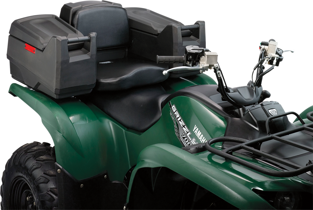 A green Yamaha Grizzly all-terrain vehicle (ATV) with a black seat, dual handlebars, rear cargo box, padded passenger backrest, and rugged tires. The photo focuses on the seat, handlebars, and cargo storage.