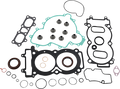 A collection of various engine gaskets and seals in different shapes and sizes, including grommets, O-rings, a large green gasket, and several black rubber gaskets, all neatly arranged on a white background.