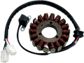 A circular metal stator with multiple copper wire coils arranged around its perimeter, attached to a black insulated cable with white plastic electrical connectors and an additional small black sensor mounted on a bracket.