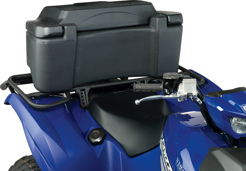 A close-up of a blue ATV shows a large black storage box mounted on the rear rack behind the seat. The image highlights the seat, storage box, part of the handlebar, and some ATV details, including the fuel cap and brand markings.