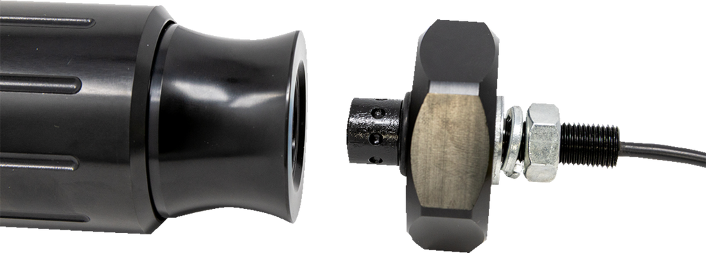 Close-up of a black cylindrical metal device with a flared end on the left and a round, knurled metal component connected to a cable on the right. Both parts are aligned but separated, showing threaded metal and a nut.