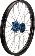A spoked motorcycle wheel with a black rim, thin silver spokes, a metallic blue hub, and Moose Racing branding on the rim. The wheel is photographed against a white background, showing its detailed construction and components.