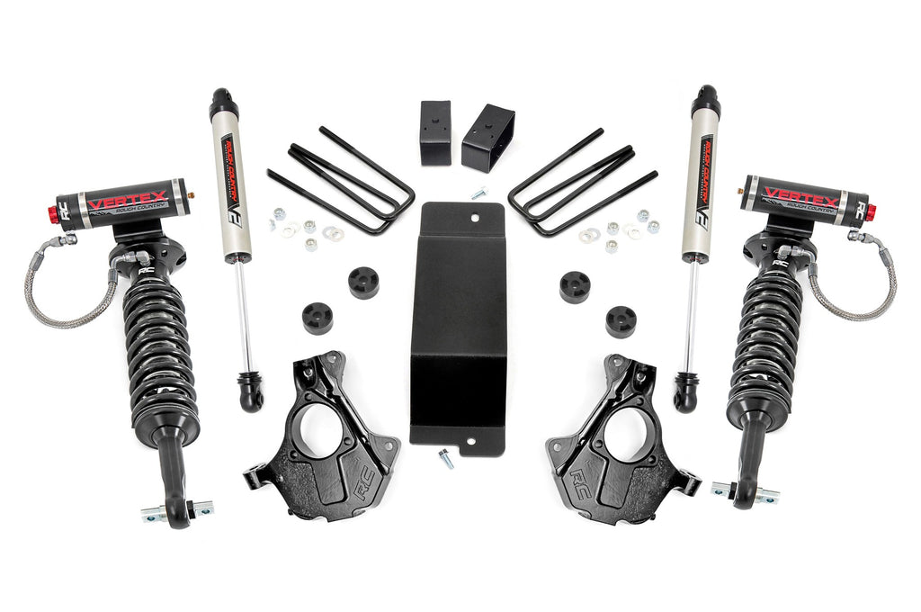 The 3.5 Inch Lift Kit for Chevy/GMC 1500 (14-18) features cast steel LCAs, Vertex/V2 shocks, black brackets, U-bolts, hardware, and black steering knuckles—all cleanly and symmetrically arranged on a white background.