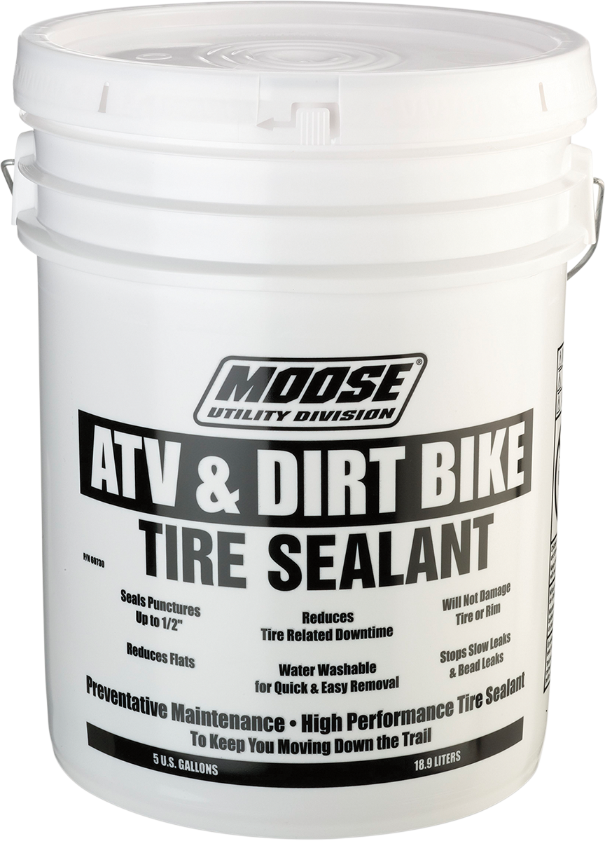 A large white plastic bucket labeled Moose Utility Division ATV & Dirt Bike Tire Sealant. The text highlights features like sealing punctures, reducing flats, water-washable, and high-performance tire sealant for preventative maintenance.