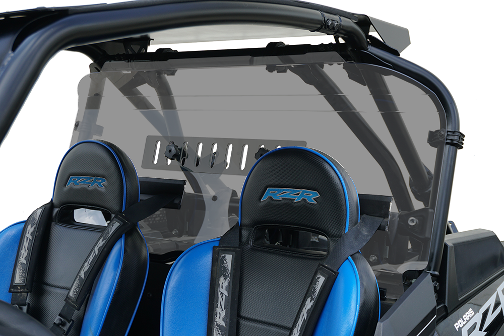 A close-up of two black and blue RZR seats with harness seatbelts, shown behind the Polaris Rzr Turbo-S Rear Shield-Tinted 2018+ on the vehicle frame, featuring visible roll bars and a vented center section.