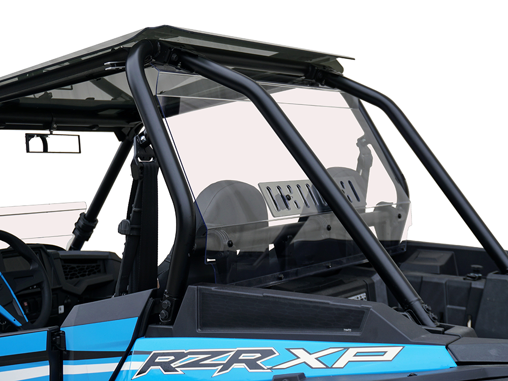 A close-up side view of the Polaris Rzr XP1000 Rear Shield w/Vent (2018+) highlights its clear rear shield with vent, sturdy black roll cage, and partial view of seats and dashboard against a plain white background.