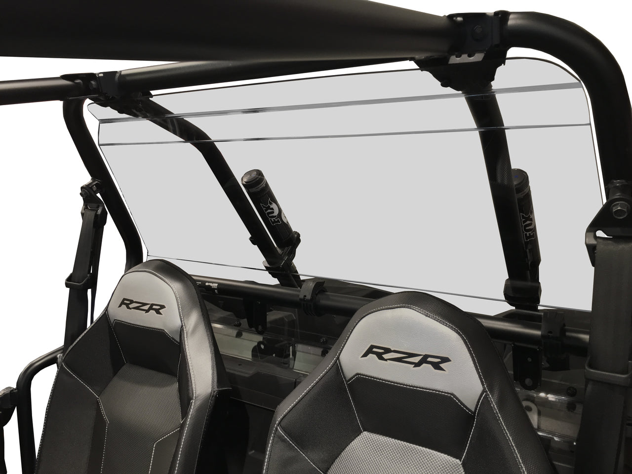 A Polaris RZR 900/1000 (New Style) Rear Windshield-GP made of clear polycarbonate is installed on a black-framed off-road vehicle with open roll cage, two black RZR-logo seats, and harness bars visible in the foreground. Background is blank.
