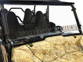 The Wolverine X-4 2015-2020 / X-2 850 2019-2020 features dual black bucket seats, a dual vented scratch resistant windshield, camouflage dashboard cover, roll cage, and open-air design, shown against a plain white background.