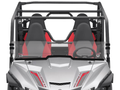 A front view of a silver Yamaha Wolverine X-4 2015-20 with a Scratch Resistant Short Windshield, roll cage, four bucket seats in black and red, visible steering wheel, and the vehicles branding on the hood.